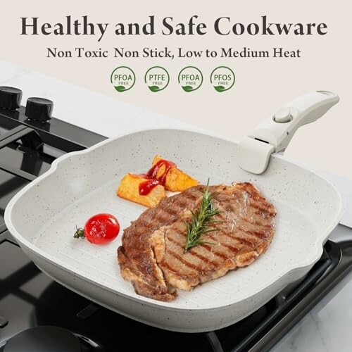 Non-toxic cookware with steak and vegetables on stove.