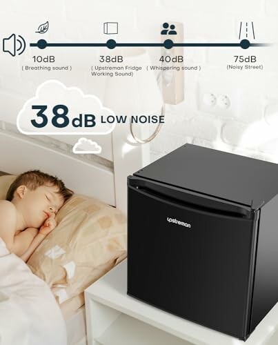 Child sleeping peacefully next to quiet mini fridge with noise level comparison chart.