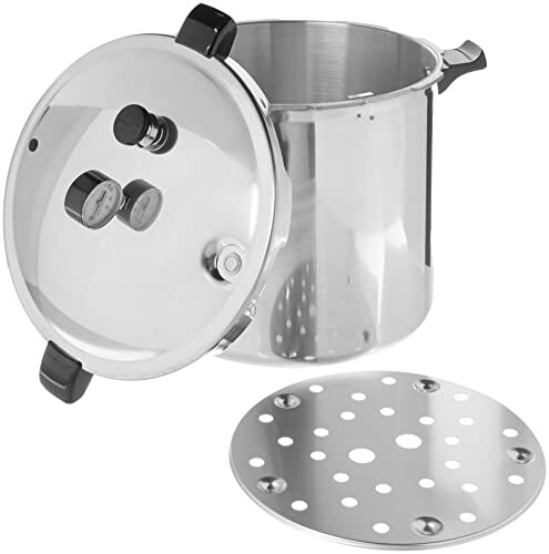 Stainless steel pressure cooker with lid and steamer insert.