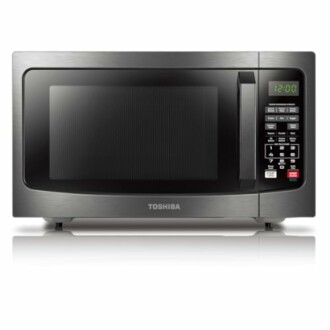 Front view of a Toshiba microwave oven with digital display and control panel.